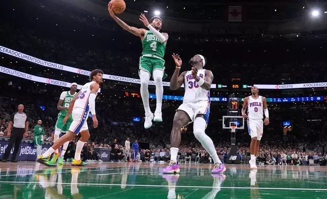 Boston Celtics guard Anfernee Simons (4) drives to the basket against the Philadelphia 76ers during the first half of an NBA basketball game, Wednesday, Oct. 22, 2025, in Boston. (AP Photo/Charles Krupa)