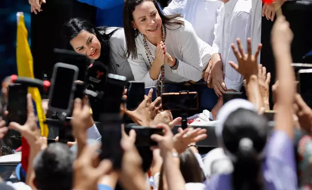 FILE - Maria Corina Machado leads a protest against the reelection of President Nicolás Maduro one month after the disputed presidential vote which she claims the opposition won by a landslide, in Caracas, Venezuela, Wednesday, Aug. 28, 2024. (AP Photo/Cristian Hernandez, File)