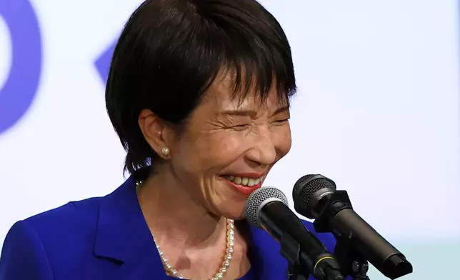Newly-elected leader of Japan's Liberal Democratic Party (LDP) Sanae Takaichi smiles while delivering a speech after winning the LDP leadership election in Tokyo, Japan, Saturday, Oct. 4, 2025. (Kim Kyung-Hoon/Pool Photo via AP)
