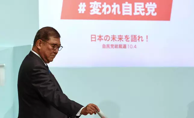 Japan's Prime Minister Shigeru Ishiba votes at the Liberal Democratic Party's (LDP) leade rship election in Tokyo, Japan, Saturday, Oct. 4, 2025. (Kim Kyung-Hoon/Pool Photo via AP)
