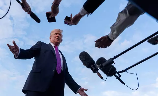 FILE - President Donald Trump speaks with reporters before he departs on Air Force One at Morristown Airport, Sunday, Sept. 14, 2025, in Morristown, N.J. (AP Photo/Alex Brandon, File)