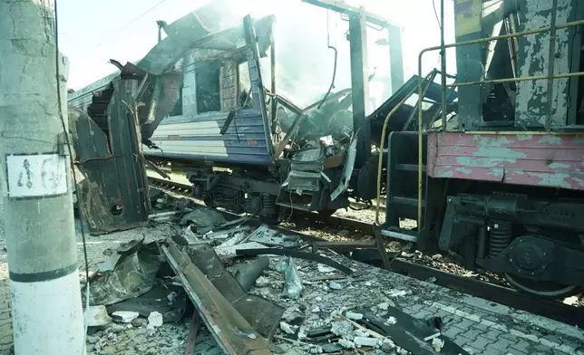 A passenger train is seen damaged following Russia's drone attack on a railway station in Shostka, Sumy region, Ukraine, Saturday, Oct. 4, 2025. (AP Photo/Kordon Media)