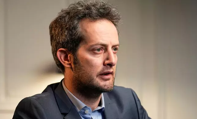 FILE - Omer Shatz the lawyer of the French-Turkish woman imprisoned in Turkey speaks during an interview with The Associated Press in Paris, Wednesday, Feb. 16, 2022. (AP Photo/Michel Euler, File)