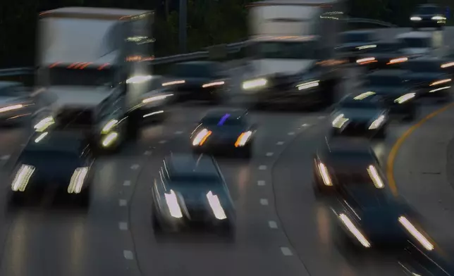 FILE - Vehicles drive along a highway July 30, 2025, in Cincinnati. (AP Photo/Joshua A. Bickel, File)