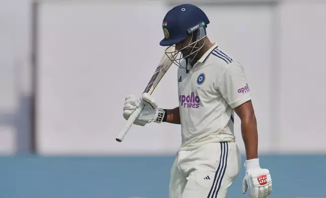 India's Nitish Kumar Reddy walks off the field after losing his wicket on the second day of the second cricket test match between India and West Indies at the Arun Jaitley Stadium in New Delhi, India, Saturday, Oct.11, 2025. (AP Photo/Manish Swarup)