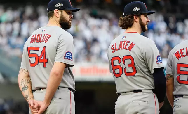 Boston Red Sox pitcher Lucas Giolito (54) stands on the field during player introductions before Game 1 of an American League wild-card baseball playoff series against the New York Yankees, Tuesday, Sept. 30, 2025, in New York. (AP Photo/Yuki Iwamura)