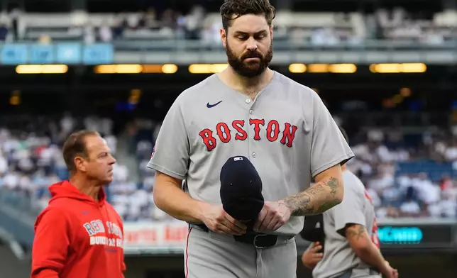 Boston Red Sox pitcher Lucas Giolito walks off the field after player introductions before Game 1 of an American League wild-card baseball playoff series against the New York Yankees, Tuesday, Sept. 30, 2025, in New York. (AP Photo/Yuki Iwamura)