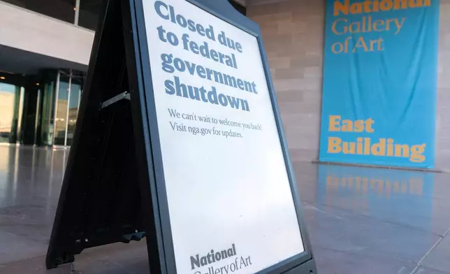 A sign that reads "Closed due to federal government shutdown," is seen outside of the National Gallery of Art on the 6th day of the government shutdown, in Washington, Monday, Oct. 6, 2025. (AP Photo/Jose Luis Magana)