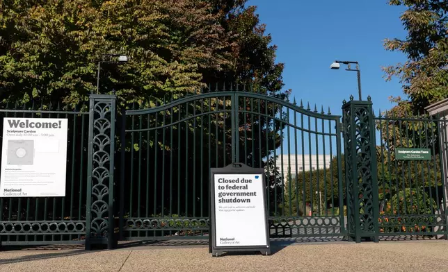 A sign that reads "Closed due to federal government shutdown" is seen outside of the Sculpture Garden on the 6th day of the government shutdown, at the National Mall in Washington, Monday, Oct. 6, 2025. (AP Photo/Jose Luis Magana)