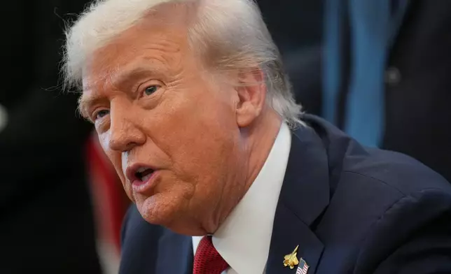 President Donald Trump speaks to reporters before signing an executive order in the Oval Office at the White House, Monday, Oct. 6, 2025, in Washington. (AP Photo/Jacquelyn Martin)