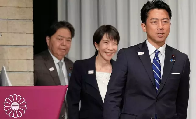 FILE - From left, Japan's chief Cabinet Secretary Yoshimasa Hayashi, former Economic Security Minister Sanae Takaichi and Agriculture Minister Shinjiro Koizumi walk into the stage for a joint press conference by the Liberal Democratic Party (LDP) presidential election candidates at the party's headquarters Tuesday, Sept. 23, 2025, in Tokyo. (AP Photo/Eugene Hoshiko, Pool, File)