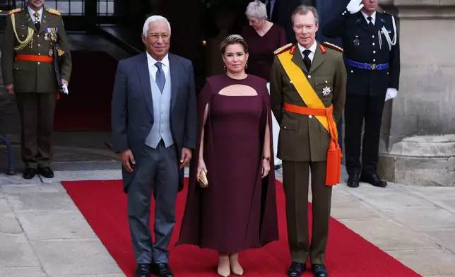 European Council President Antonio Costa, left, is greeted by Luxembourg's Grand Duke Henri, right, and Grand Duchess Maria Teresa as he arrives for the abdication and enthronement ceremony of the Grand Duke of Luxembourg at the Grand Ducal Palace in Luxembourg, Friday, Oct. 3, 2025. (AP Photo/Omar Havana)