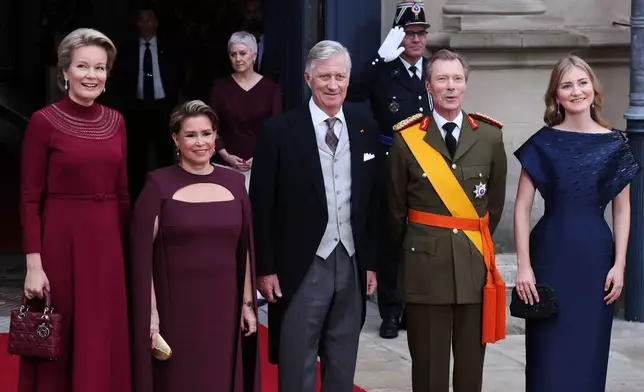 From left, Belgium's Queen Mathilde, Luxembourg's Grand Duchess Maria Teresa, Belgium's King Philippe, Luxembourg's Grand Duke Henri and Belgium's Princess Elisabeth pose during arrivals for the abdication and enthronement ceremony of the Grand Duke of Luxembourg at the Grand Ducal Palace in Luxembourg, Friday, Oct. 3, 2025. (AP Photo/Omar Havana)