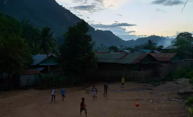 Children play soccer at the Mae La refugee camp in the Tak province of Thailand, Friday, Aug. 29, 2025. (AP Photo/Bram Janssen)