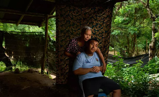 Ababa Moe, left, poses for a portrait with her son, Ababa, near their refugee camp in the Tak province of Thailand, Wednesday, Aug. 27, 2025. (AP Photo/Bram Janssen)