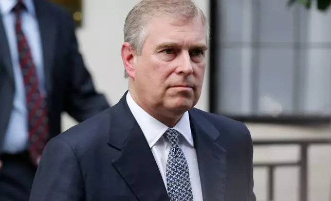 FILE- Britain's Prince Andrew leaves King Edward VII hospital in London after visiting his father Prince Philip, June 6, 2012. (AP Photo/Sang Tan, File)