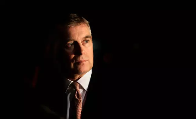 FILE - Britain's Prince Andrew looks on during an event at the residence of the British Ambassador in New Delhi, India, March 10, 2010. (AP Photo/Manish Swarup, File)