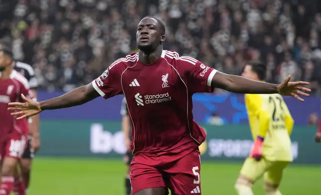 Liverpool's Ibrahima Konate celebrates after scoring his side's third goal during the Champions League opening phase soccer match between Eintracht Frankfurt and Liverpool in Frankfurt, Germany, Wednesday, Oct. 22, 2025. (AP Photo/Michael Probst)