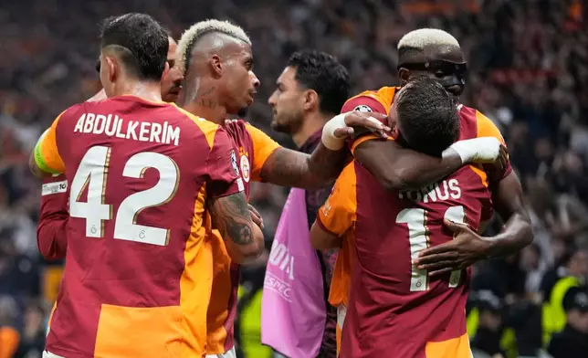 Galatasaray's Yunus Akgun, front right, celebrates with teammates after scoring his side's third goal during the Champions League opening phase soccer match between Galatasaray and Bodo Glimt, in Istanbul, Turkey, Wednesday, Oct. 22, 2025. (AP Photo/Khalil Hamra)