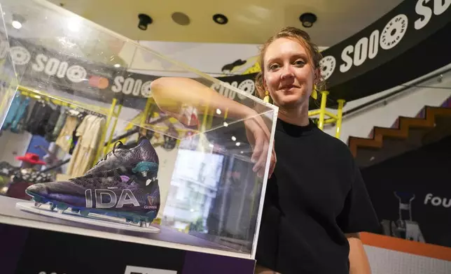 Laura Youngson, CEO of IDA Sports, poses for photographs at a store in Regent Street, in London, Thursday, Sept. 18, 2025. (AP Photo/Alberto Pezzali)
