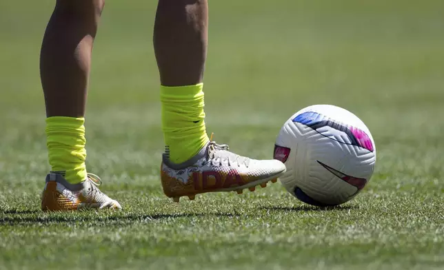 Washington Spirit midfielder Courtney Brown warms up with cleats that read "IDA" before a NWSL soccer match against Bay FC on Saturday, Aug. 23, 2025, in San Francisco. (AP Photo/Benjamin Fanjoy)