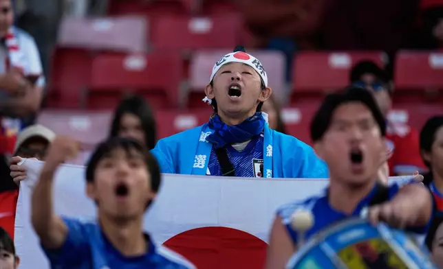 Japan fans cheer prior to a FIFA U-20 World Cup Group A soccer match against Chile at National Stadium in Santiago, Chile, Tuesday, Sept. 30, 2025. (AP Photo/Matias Delacroix)