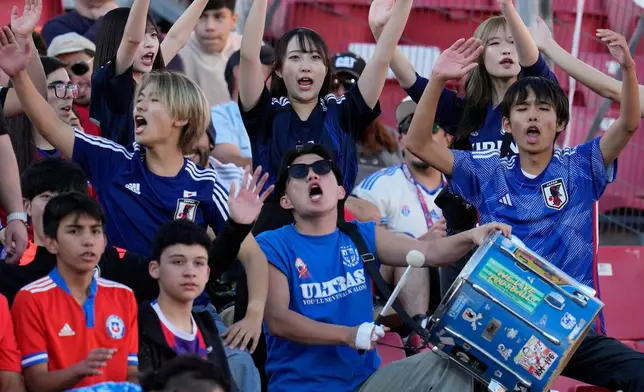 Fans of Japan attend a FIFA U-20 World Cup Group A soccer match between Japan and Egypt at National Stadium in Santiago, Chile, Saturday, Sept. 27, 2025. (AP Photo/Esteban Felix)