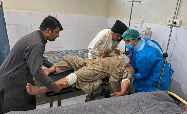 A man, who was injured in the clashes between Pakistan and Afghan forces in border area, receives medical treatment at a hospital in Chaman, a town on the Pakistan side of the Afghanistan border, Wednesday, Oct. 15, 2025. (AP Photo/H. Achakzai)