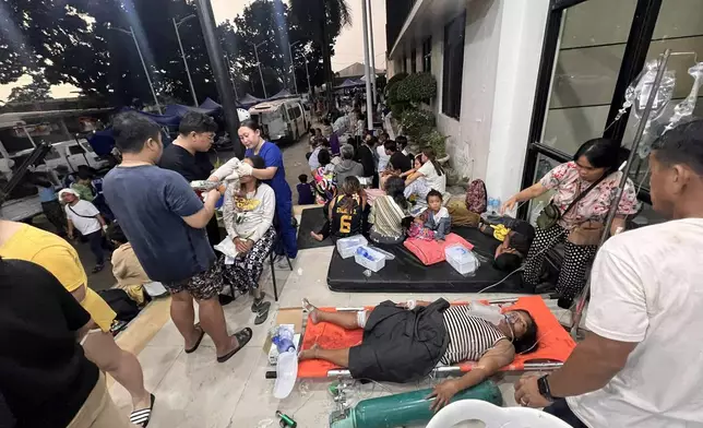 Patients wait outside the Cebu Provincial Hospital Bogo City after a strong earthquake struck in Bogo city, Cebu province, central Philippines, Wednesday Oct. 1, 2025. (AP Photo)