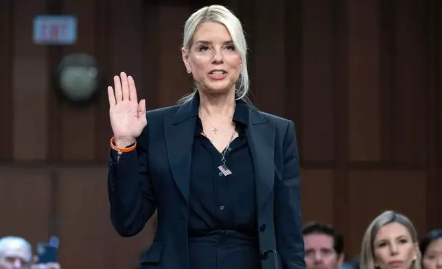 Attorney General Pam Bondi is sworn in before a Senate Judiciary Committee oversight hearing on Capitol Hill in Washington, Tuesday, Oct. 7, 2025. (AP Photo/Jose Luis Magana)