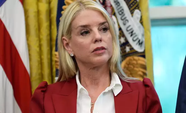 Attorney General Pam Bondi listens as President Donald Trump signs a presidential memorandum on the death penalty in the District of Columbia in the Oval Office at the White House, Thursday, Sept. 25, 2025, in Washington. (AP Photo/Alex Brandon)