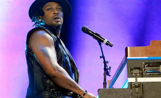 FILE - This July 6, 2012 file photo D'Angelo performs at the Essence Music Festival in New Orleans. (Photo by Cheryl Gerber/Invision/AP, File)