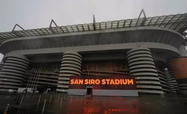 FILE - Rain falls on San Siro Stadium, venue for the opening ceremony of the Milan Cortina 2026 Winter Olympics, in Milan, Italy, Monday, Jan. 27, 2025. (AP Photo/Luca Bruno, File)