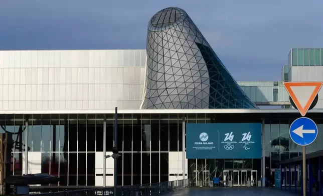 FILE - A view of the main entrance of the Rho Fair, which will be called Milano Ice Park, venue for the ice hockey and speed skating disciplines at the Milan Cortina 2026 Winter Olympics, in Rho, near Milan, Italy, Tuesday, Jan. 28, 2025. (AP Photo/Luca Bruno, File)