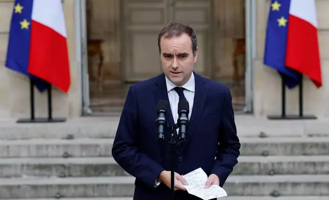 French outgoing Prime Minister Sebastien Lecornu makes a statement at the Hotel Matignon, the Prime Minister's residence, Wednesday, Oct. 8, 2025. (Stephanie Lecocq, Pool via AP)