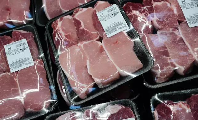 Pork chops are on display at a Sam's Club, Wednesday, Sept. 24, 2025, in Bentonville, Ark. (AP Photo/Charlie Riedel)