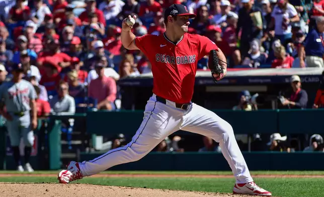 Cleveland Guardians starting pitcher Gavin Williams throws during the third inning of Game 1 of the American League Wild Card baseball playoff series against the Detroit Tigers in Cleveland, Tuesday, Sept. 30, 2025. (AP Photo/Phil Long)