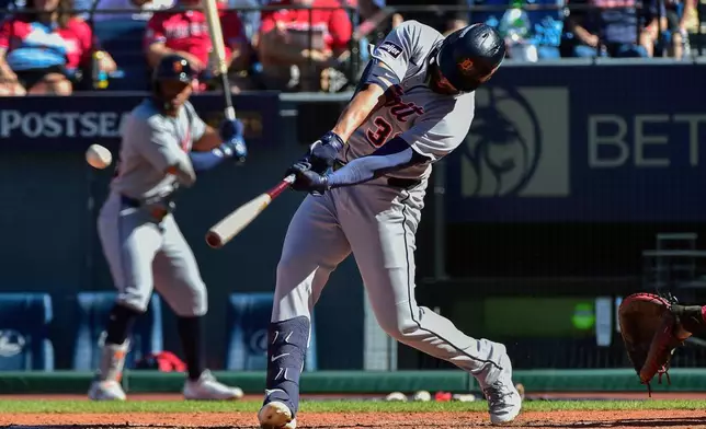 Detroit Tigers' Riley Greene hits a double in the seventh inning of Game 1 of the American League Wild Card baseball playoff series against the Cleveland Guardians in Cleveland, Tuesday, Sept. 30, 2025. (AP Photo/Phil Long)