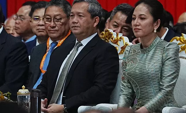 Cambodian Prime Minister Hun Manet, second from right, presides over together with his wife Pich Chanmony during an inauguration of Techo International Airport in Kandal province, Cambodia, Monday, Oct. 20, 2025. (AP Photo/Heng Sinith)