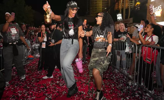 Las Vegas Aces forward A'ja Wilson and guard Aaliyah Nye celebrate during a rally to celebrate the team's WNBA championship Friday, Oct. 17, 2025, in Las Vegas. (AP Photo/Candice Ward)