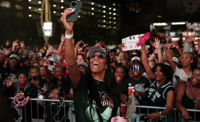 Las Vegas Aces forward A'ja Wilson celebrates during a rally to celebrate the team's WNBA championship Friday, Oct. 17, 2025, in Las Vegas. (AP Photo/Candice Ward)