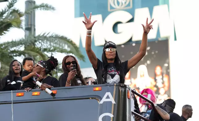 Las Vegas Aces forward A'ja Wilson celebrates during a rally to celebrate the team's WNBA championship Friday, Oct. 17, 2025, in Las Vegas. (AP Photo/Candice Ward)