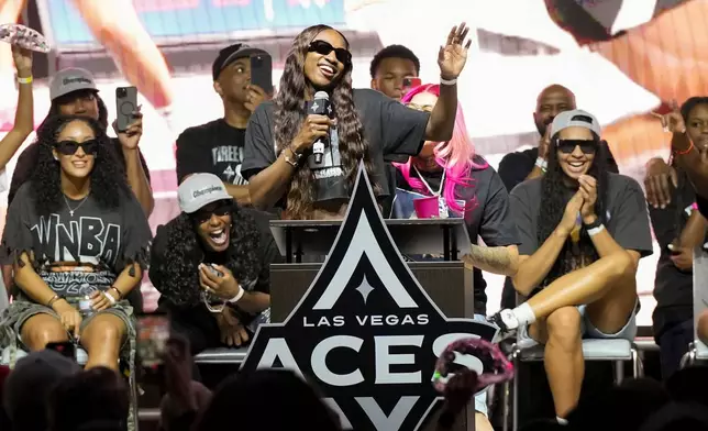 Las Vegas Aces guard Jackie Young celebrates during a rally to celebrate the team's WNBA championship Friday, Oct. 17, 2025, in Las Vegas. (AP Photo/Candice Ward)