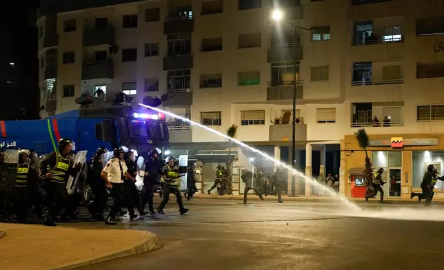 Security forces disperse a gathering as youth led protests calling for healthcare and education reforms turned violent, in Sale, Morocco, Wednesday, Oct. 1, 2025. (AP Photo/Mosa'ab Elshamy)