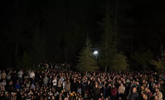 Mourners attend the funeral of slain hostage Captain Daniel Peretz at Mt. Herzl military cemetery in Jerusalem, Wednesday, Oct. 15, 2025. Peretz's body was returned from Gaza to Israel as part of a ceasefire agreement between Israel and Hamas. (AP Photo/Francisco Seco)
