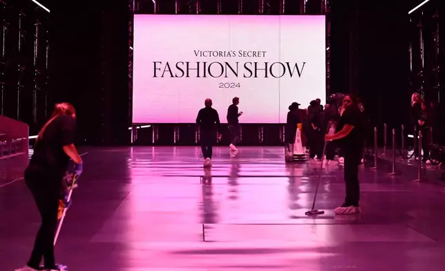 FILE - People prepare the runway prior to the Victoria's Secret Fashion Show Oct. 15, 2024, in the Brooklyn borough of New York. (Photo by Evan Agostini/Invision/AP/File)