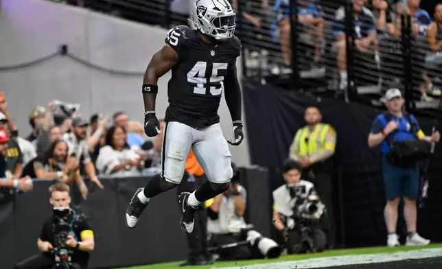 Las Vegas Raiders linebacker Devin White (45) celebrates after forcing a fumble by the Tennessee Titans during the first half of an NFL football game, Sunday, Oct. 12, 2025, in Las Vegas. (AP Photo/David Becker)