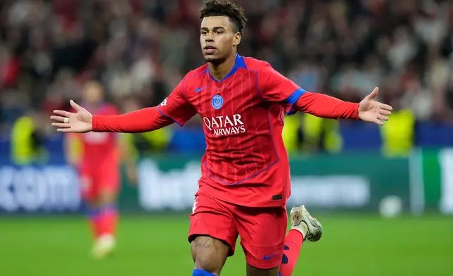 PSG's Desire Doue celebrates after scoring his side's second goal during a Champions League opening phase soccer match between Bayer Leverkusen and Paris Saint-Germain in Leverkusen, Germany, Tuesday, Oct. 21, 2025. (AP Photo/Martin Meissner)