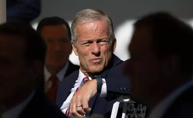 Senate Majority Leader John Thune, R-S.D., listens as President Donald Trump speaks as he hosts a lunch with Republican Senators on the Rose Garden patio at the White House, Tuesday, Oct. 21, 2025, in Washington. (AP Photo/Manuel Balce Ceneta)