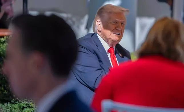 President Donald Trump hosts lunch with Republican Senators on the Rose Garden patio at the White House, Tuesday, Oct. 21, 2025, in Washington. (AP Photo/Manuel Balce Ceneta)